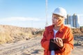 A middle aged woman on a construction site inspects the work carried out Royalty Free Stock Photo