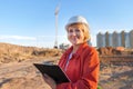 A middle aged woman on a construction site inspects the work carried out Royalty Free Stock Photo