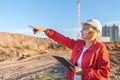 A middle aged woman on a construction site inspects the work carried out Royalty Free Stock Photo
