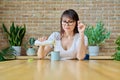 Middle aged woman drinking fermented milk product from bottle