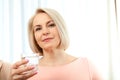 Middle aged woman drinking water in morning. Royalty Free Stock Photo