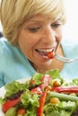 Middle Aged Woman Eating Healthy Salad Royalty Free Stock Photo