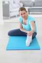 Middle-aged woman excercising and stretching Royalty Free Stock Photo