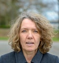 Middle aged woman front portrait with open mouth