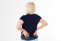 Middle-aged woman holds her hands on a sore back, back pain, rheumatism, rehabilitation concept health care, Middle-aged blonde