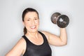 Middle aged woman lifting dumbbell Royalty Free Stock Photo