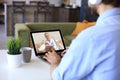 Middle aged woman making video call with her doctor during self isolation and quarantine. Royalty Free Stock Photo