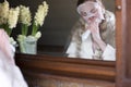 a woman in a mask brushing her teeth with an electric toothbrush Royalty Free Stock Photo