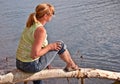 Middle Aged Woman Relaxing at Lake Royalty Free Stock Photo