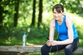 Middle Aged Woman Relaxing With MP3 Player After Exercise Royalty Free Stock Photo