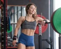 Middle aged woman resting before deadlifting at the gym. Royalty Free Stock Photo