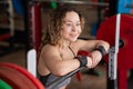 Middle aged woman resting after deadlifting in the gym. Royalty Free Stock Photo