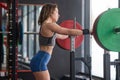 Middle aged woman resting before deadlifting at the gym. Royalty Free Stock Photo