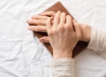 Middle aged woman's hands on journal