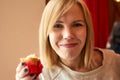 A middle aged woman smiles indoors Royalty Free Stock Photo