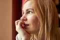 A middle aged woman smiles indoors Royalty Free Stock Photo