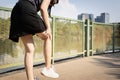 Middle aged woman suffering from knee ache,patella friction against the thigh bone,painful in the kneecap,Patellofemoral pain Royalty Free Stock Photo