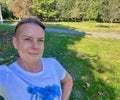 a middle-aged woman sunbathing in nature Royalty Free Stock Photo