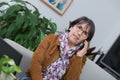 Middle-aged woman talking on phone at home Royalty Free Stock Photo