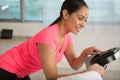 middle aged woman using exercise machine at home Royalty Free Stock Photo