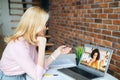 Middle-aged woman using laptop for video call Royalty Free Stock Photo