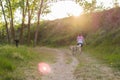 Middle-aged woman walking with her dog on a mountain path Royalty Free Stock Photo