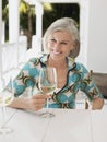 Middle Aged Woman With Wine Glass At Outdoor Table Royalty Free Stock Photo