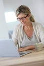 Middle-aged woman working on laptop Royalty Free Stock Photo
