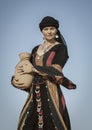 Woman in a desert with a water dish