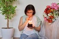 Middle-aged women with small birthday cake with candles Royalty Free Stock Photo