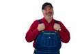 Middle-aged worker in dungarees with a proud smile