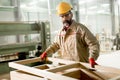 Middle aged worker working in the furniture factory Royalty Free Stock Photo