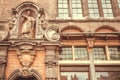 Middle ages facade of historical house with sculptures and decor in Ghent, Belgium. Example of architecture of Europe