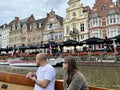 Medieval Buildings Along the River Lys Overlook Boats Designed for Visitor Tours in July 2024 in Ghent, Belgium