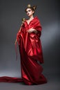 Middle Ages. Magic. Lordly Woman Wizard in Red Pallium with Scepter. Witchcraft