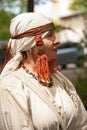 Middle ages period costume - senior Caucasian woman dressed in simple white dress