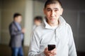 Middle Asian man short haircut with phone in his