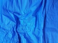 Middle Blue Wrinkled Paper Background Satin Blank Texture, Creased Surface. For Web And Print