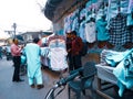 Middle Class People Buys A Shirt In Street Shop