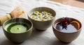 The middle cup is filled with a chamomile infusion topped with floating daisy Royalty Free Stock Photo