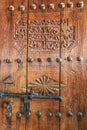 A carved wooden door to a shop in the craft souk in Nizwa, Oman