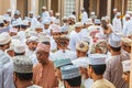 Men haggling over goods at the souk in Nizwa Royalty Free Stock Photo