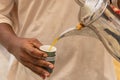 Pouring tea at a market in Buraydah