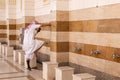 Washing feet before entering Fash Mosque below Mount Uhud Royalty Free Stock Photo