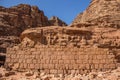 Middle East sightseeing historical site Wadi Rum desert scenic landscape sand stone rocky environment with some brick wall ruins