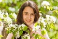 Middle East teenager girl with white pear flowers Royalty Free Stock Photo