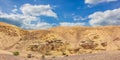 Middle East world heritage Judean desert nature scenery landscape view of sand stone wasteland foreground and rocky mountain Royalty Free Stock Photo