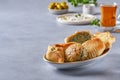 Middle eastern, arabic breakfast with traditional pastries and labneh. Pasties, fatayer or samosa with spinach , potato and