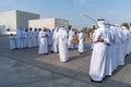 Middle Eastern Arabic Culture - Emirati Men performing Al Ayala traditional dance - Arabic men cloth