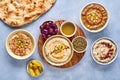 Middle eastern, arabic traditional breakfast with hummus, foul, mutabbal, qudsia and zaatar. Top view